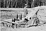 A 21 cm mortar with ammunition.