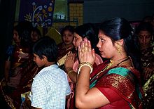 Shakta Hindus in Dhaka, Bangladesh, pray to the goddess during Durga Puja. October 2003. Bangladesh Prayer.jpg