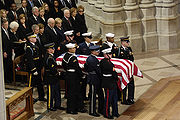 The casket of President Gerald R. Ford is carried past a group that includes President George W. Bush, First Lady Laura Bush and former Presidents George H. W. Bush, Bill Clinton, and Jimmy Carter at the National Cathedral in Washington January 2, 2007.