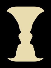 Rubin's vase is an optical illusion in which the negative space around the vase forms the silhouettes of two faces in profile, a well-known example of figure-ground reversal by emphasizing that negative space. Face or vase ata 01.svg