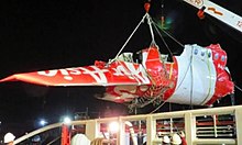 A section of the aircraft after its recovery Indonesia AirAsia Flight 8501 wreckage.jpg