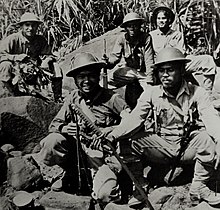 Philippine Scouts display a sword taken from the body of a Japanese officer during the Battle of Bataan, April 1942. Lot-9432-17 (23555117450).jpg