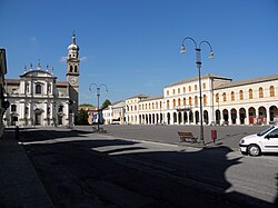 Fetonte Square, at left the baroque facade of Santi Martino and Severo Church and at right the Town Hall