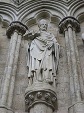 Sculpture on the west front of the cathedral of Bishop Richard Poore who oversaw the early years of its construction, beginning in 1220; he is holding a model of the cathedral Richard Poore.jpg