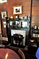 The fireplace in the dining room of the mission house at The Elms