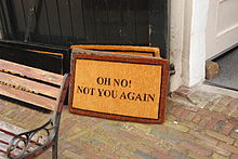A not very welcoming message on a doormat