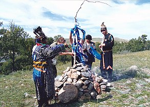 Tuvan shaman consecrating an ovoo