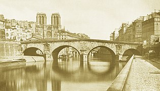 Il pont Saint-Michel del 1616 liberato delle sue case nel 1857.