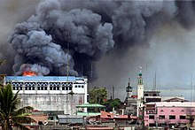 A building in Marawi set ablaze after President Rodrigo Duterte ordered the Philippine Air Force to conduct airstrikes against IS insurgents in the city during the Battle of Marawi Bombing on Marawi City.jpg