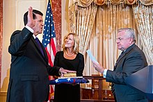 Krach sworn in as Under Secretary of State for Economic Growth, Energy, and the Environment by John J. Sullivan in 2019 Deputy Secretary Sullivan Officiates the Swearing-In Ceremony for Under Secretary Krach (48744351152).jpg