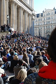 Assange speaks at the Occupy London outside the cathedral in the City of London. Julian Assange speaking at Occupy London protest.jpg