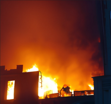 Burning building in Podilskyi District on 15 March Kiev shelling.png