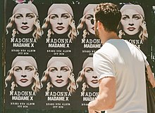 A Madonna billboard of her 2019 album, Madame X Madaonna - Madama X album (48122941058).jpg