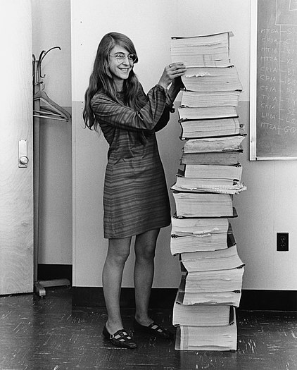 #6: Margaret Hamilton standing next to the navigation software that she and her MIT team produced for the Apollo Project Attribution: Draper Laboratory; restored by Adam Cuerden. (public domain)