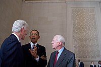 Carter, Obama, and Clinton standing together.