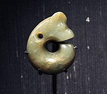 A Chinese Neolithic (Hongshan culture) jade ornament in the form of a curled pig dragon British Museum Chinese jade Neolithic period Hongshan culture Coiled dragon Pig-dragon 11022019 1393.jpg