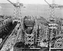 Bethlehem Steel constructing two World War II warships, HMS Calder (left) and USS Foss (right) in 1943 during World War II Buckley class destroyer escorts under construction at the Bethlehem Hingham Shipyard, Massachusetts (USA), on 20 January 1943 (BS 85616).jpg