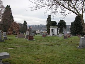 Calvary Cemetery in Ravenna/Bryant with University of Washington residence towers in background.