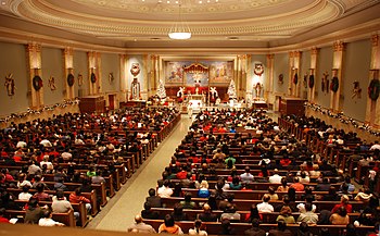 Many Christians attend church services on Christmas Eve, the Christian vigil that celebrates the birth of Jesus Christ. Complete-church-midnight-mass (3135957575).jpg