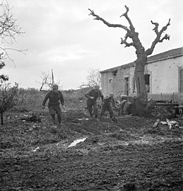 Riflemen of the 48th Highlanders of Canada take cover during German counterattack north of San Leonardo, 10 Dec 1943