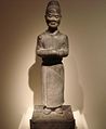 A limestone statue of a mourning attendant, 7th century, Tang Dynasty