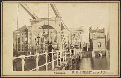 Drawbridge over Singelgracht at Leidseboschje with the old Stadsschouwburg (Miunicipal Theater) in the background