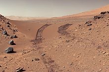 Curiosity's view of Martian soil and boulders after crossing the "Dingo Gap" sand dune PIA17944-MarsCuriosityRover-AfterCrossingDingoGapSanddune-20140209.jpg