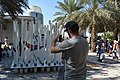 Tourist at Zabeel Park taking photos for the UAE Pearl installation