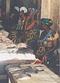 Women selling fish at a market in the Gambia