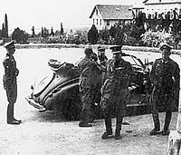 Georgios Tsolakoglou with Wehrmacht officers arrives at Macedonia Hall of Anatolia College in Thessaloniki, to sign the surrender (April 1941) AnatoliaCollege-SurrenderofGreece.jpg