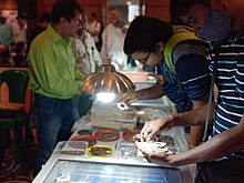 Coin collectors and enthusiasts at an exhibition organized by the Numismatic Society of Calcutta, Kolkata, West Bengal Coin collectors and enthusiasts by Yogabrata Chakraborty, 2022.jpg