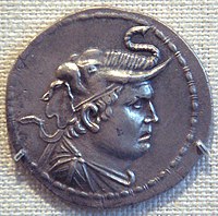 Silver coin of Demetrius I of Bactria (reigned c. 200-180 BC) in the Greco-Bactrian standard, wearing an elephant scalp, symbol of his conquests of areas in the northwest of the Indian subcontinent. DemetriusIMet.jpg