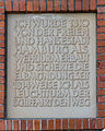 Inscription to the left of the entrance