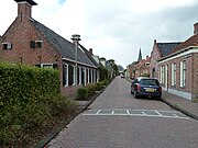 Ingang naar de Westerhofstraat waaraan kerk en pastorie staan