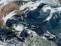 A satellite photo of Tropical Storm Lisa (center left, approaching Central America) and Tropical Storm Martin (upper right, over the open Atlantic Ocean southeast of Atlantic Canada) on November 1, 2022.