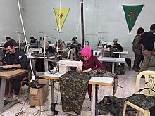 Rojava is supporting efforts for workers to form cooperatives such as this sewing cooperative Rojava Sewing Cooperative.jpg