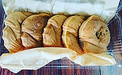Round taiyaki in the form of coiled fishes, being sold in Gunma