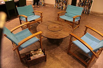 An electric wire reel reused as a center table in a Rio de Janeiro decoration fair. The reuse of materials is a sustainable practice that is rapidly growing among designers in Brazil. Electric wire reel reused in a furniture ecodesign.jpg