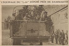 newspaper clipping of men in the back of a truck