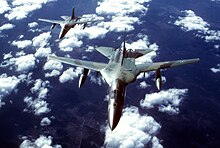 An air-to-air front overhead view of two FB-111s in formation