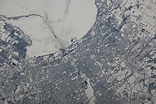 Open water appears near the mouth of the Fox due to the warmth of the water coming out of the generating station. Photo taken by an Expedition 38 crew member on February 22, 2014 ISS-38 Green Bay, Wisconsin.jpg