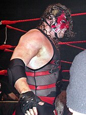 Kane in 2003, wearing his half mask weeks before his unmasking on Raw Kane2003.jpg