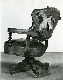 A chair used by Abraham Lincoln when he visited the Cooper Union in 1860. This is before it was reupholstered in 1949. Lincoln Chair at the Cooper Union Museum.jpg