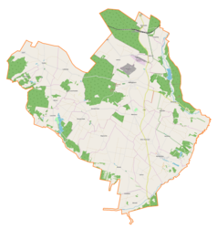 Mapa konturowa gminy Małogoszcz, u góry nieco na prawo znajduje się punkt z opisem „Małogoszcz”