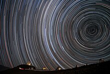 Starry circles arc around the south celestial pole, seen overhead at ESO's La Silla Observatory. Starry Spin-up.jpg