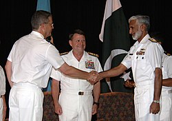 US Navy 090720-N-8053S-068 French Rear Adm. Alain Hinden, left, shakes hands with Pakistan Navy Rear Adm. Muhammad Zakaullah at the Combined Task Force (CTF) 150 change of command ceremony.jpg