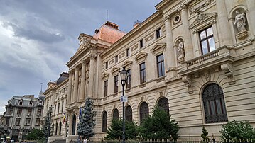 Beaux-Arts aka Eclectic - Exterior of the Old National Bank of Romania Palace, Bucharest, 1883–1900, by Joseph-Marie Cassien Barnard and Albert Galleron, assisted by Grigore Cerkez and Constantin Băicoianu[37]