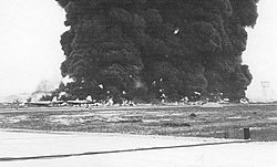 Burning American aircraft at Bien Hoa Air Base in 1965 Burning Aircraft on ramp at Bien Hoa AB -1.jpg