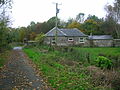 Millburn Lodge and gate; a post 1858 building. Home to one of the Eglinton Castle estate gamekeepers.[2]