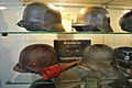 Display of German artifacts including a training version of the stick grenade and a chemical weapons test kit